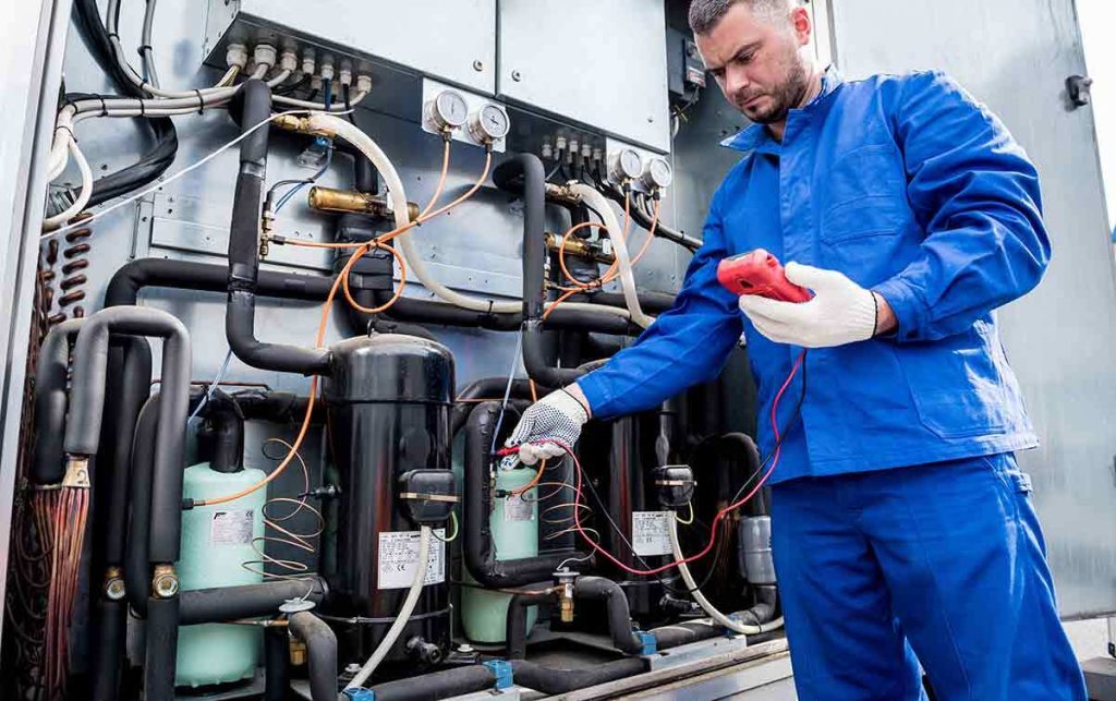 Emergency heating system repair in Maui by HVAC technician servicing residential heating equipment.