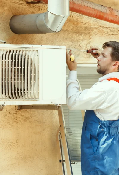 Certified HVAC technician performing repair and diagnostic service on an outdoor unit in Maui