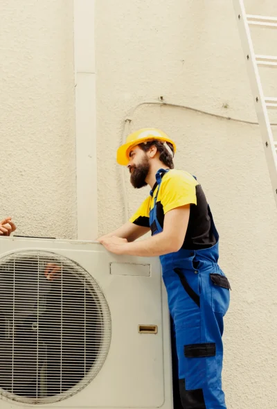 repairmen-taking-apart-hvac-system-scaled.webp